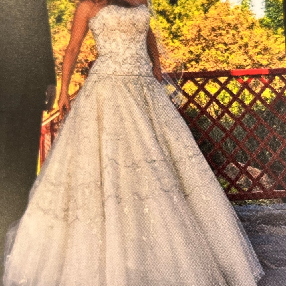 Kenneth Poole wedding dress.   Size 8 appropriate.  Lace up back.  Elegant.